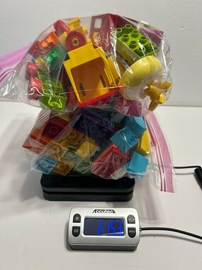 Large mixed lot of Lego Duplo building bricks. Over 130 pieces, mixed shapes.